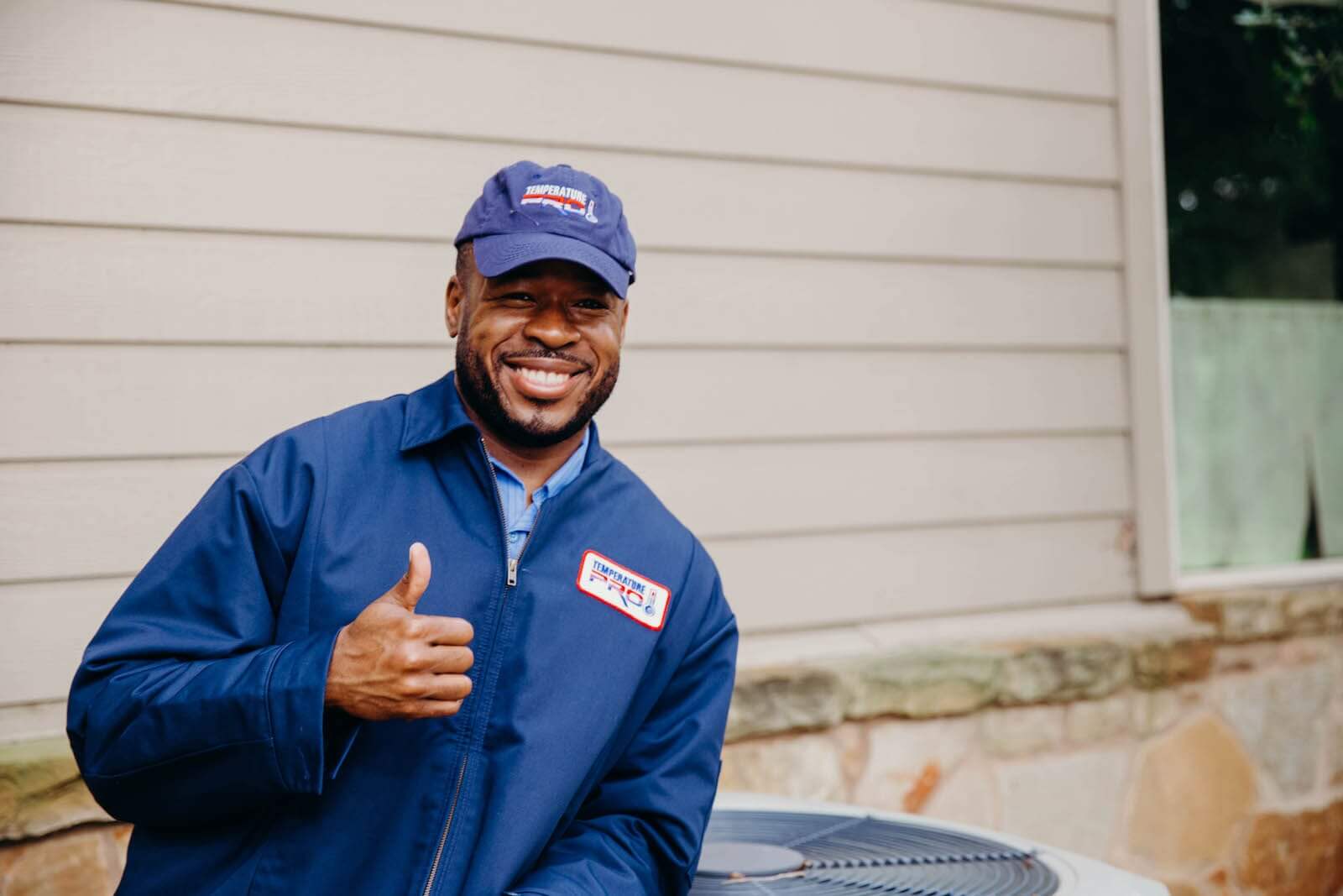 hvac technician with thumbs up